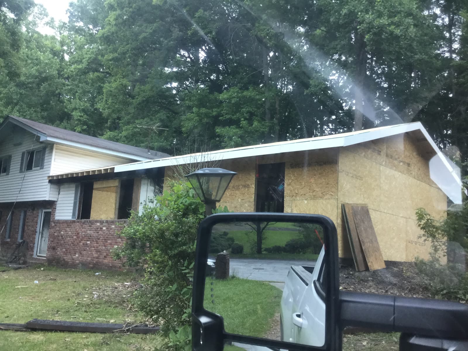 Home addition sheathed and sealed with a new roofline
